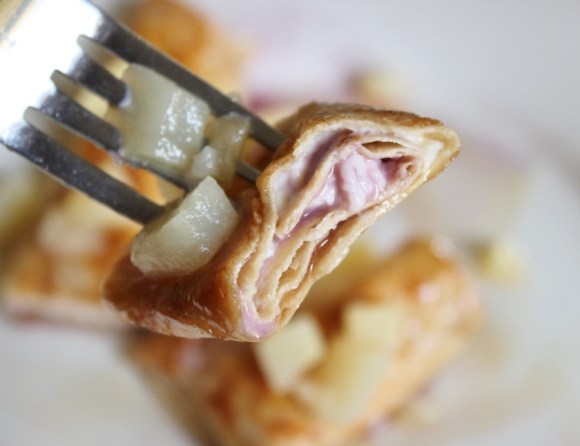 Bite-sized piece of Cream Cheese and Jam Chimichanga on the fork.