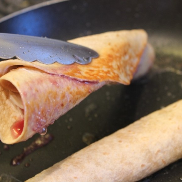 Flipping golden brown Cream Cheese and Jam Chimichanga