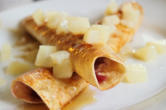 Cream Cheese and Jam Chimichangas served with a diced pear and maple syrup topping.