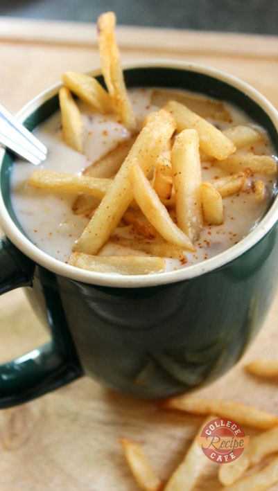Digging Spoon Into Creamy Corn Chowder With Fries