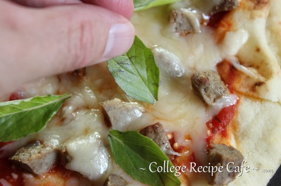 Tangy fresh basil make this pizza look extra good!