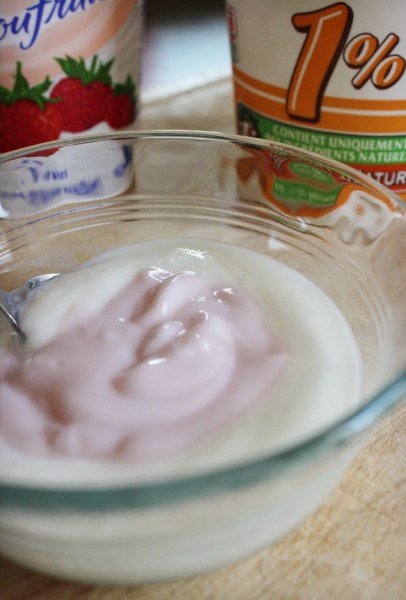 To reduce the amount of added sugar in stirred fruit yogurt, mix it with plain yogurt.