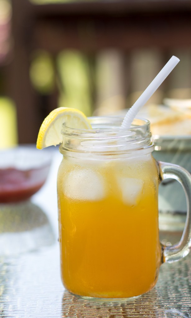 Lemon Ginger Iced Tea served with a lemon slice.