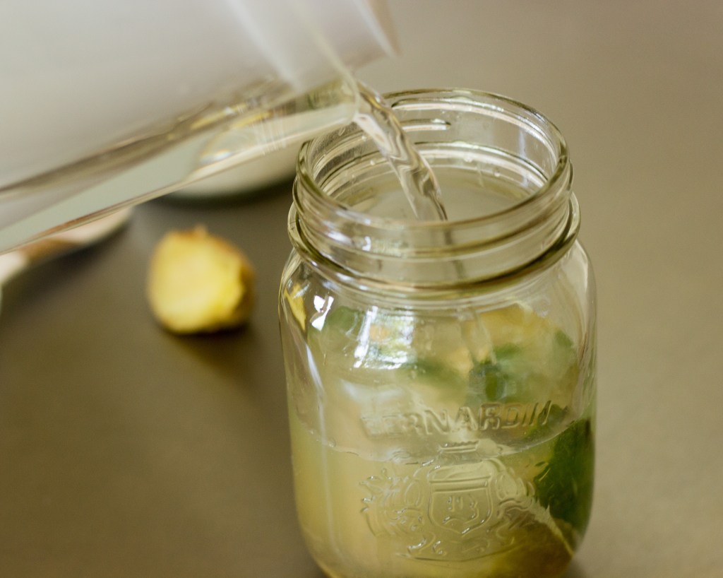 Pouring water into mason jar
