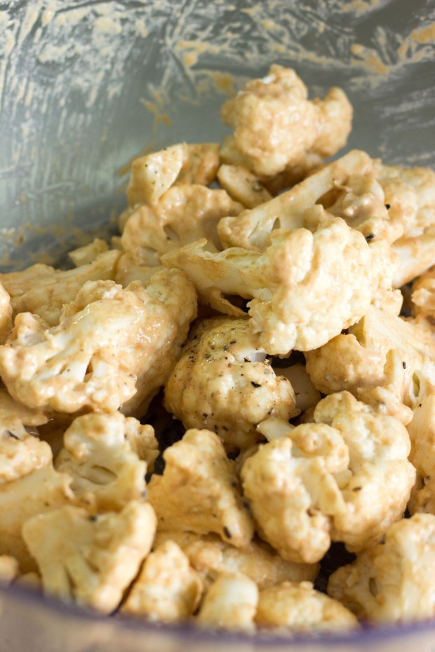 Coated cauliflower ready for roasting